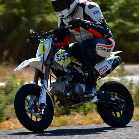 biker riding white pitbike