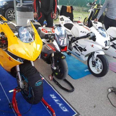 four pitbikes at the pit