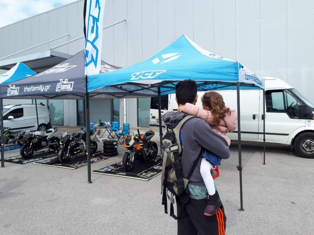 Father and daughter look pitbikes