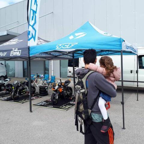 Father and daughter look pitbikes