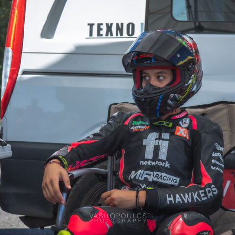 Girl Rider with helmet and racing suit