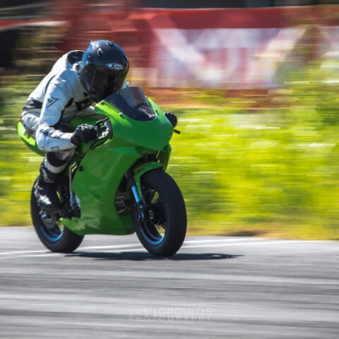 rider with green pitbike at the straight